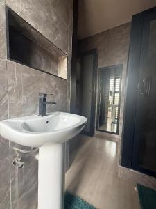 Koupelna v ubytování Infinity Apartments