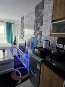 a room with a kitchen with a counter top at Be Happy Homes Tsavo Fedha 513 in Nairobi +2 photos