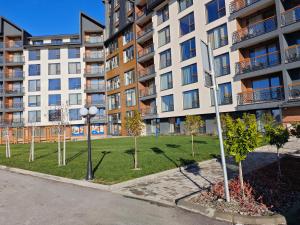 a park in front of a apartment building at Harmony, Residence Hill A85 in Kopaonik