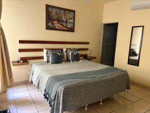 Postel nebo postele na pokoji v ubytování Casa Piedra Parada