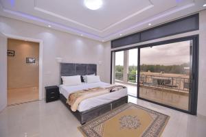 Ένα ή περισσότερα κρεβάτια σε δωμάτιο στο Villa Route de Fes in Marrakesh