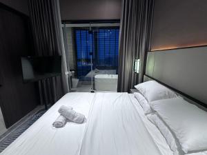 Ένα ή περισσότερα κρεβάτια σε δωμάτιο στο All new HillTop Antara 9 min walk to genting 9Pax