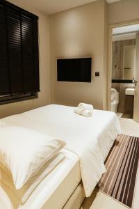 Ένα ή περισσότερα κρεβάτια σε δωμάτιο στο All new HillTop Antara 9 min walk to genting 9Pax +1 φωτογραφίες