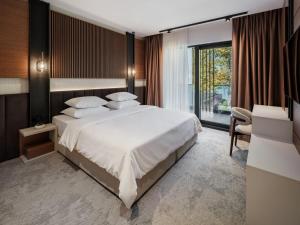 Giường trong phòng chung tại Hotel Dunav