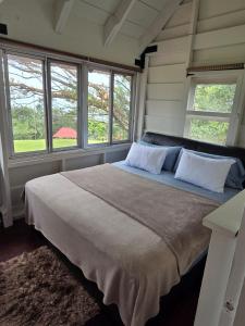 Giường trong phòng chung tại La Dama de los vientos