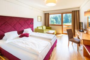 Postel nebo postele na pokoji v ubytování Hotel NockResort