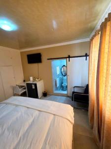 En eller flere senge i et værelse på Sweet Home B & B