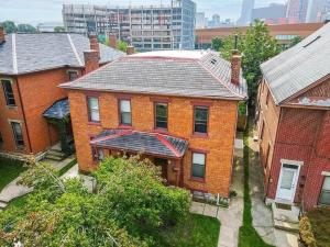 an aerial view of a brick house in a city at Jungle House Columbus Downtown Free Parking Sleeps 8 - Steps to Convention Center & Nationwide Arena - 2BR Short North Luxury Home - Over 5,800 Five Star Stays in Columbus