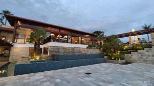 a large building with a lot of windows at Resort Quinta Santa Barbara in Pirenópolis