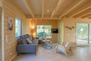 a living room with a couch and a table at Am Hafen 21 in Zislow