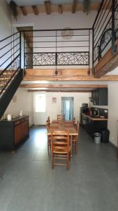 a large room with a table and chairs in it at Gite de la semoy in Haulmé