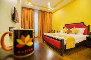 Postel nebo postele na pokoji v ubytování Hotel Kapish Smart-All Pure Veg