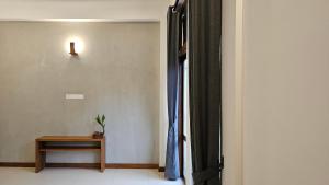 a room with a window with a table and a curtain at nelli house in Galle +23 photos