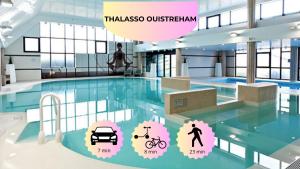 a building with a swimming pool with icons of a car at La Coquille Séjour en Duo Confort Maisonnette de bourg à Ouistreham - Situation idéale commerces & plage - Wifi et linge inclus in Ouistreham +25 photos