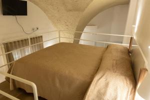 Ένα ή περισσότερα κρεβάτια σε δωμάτιο στο Le Casarelle