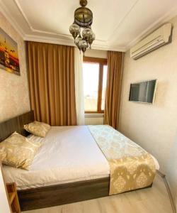 a bedroom with a bed and a window at My Home Premium in Sultanahmet