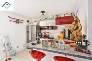 a kitchen with a counter with a bar sign on it at Villa Irene in Castiglioncello by TuscanyWeGo in Chioma