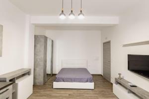 Кровать или кровати в номере Vicolo Mediterraneo Apartment