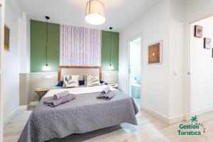 Кровать или кровати в номере Ático centro Huelva con parking