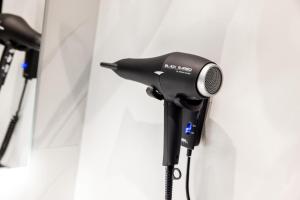 a microphone on a tripod next to a wall at NH Mannheim in Mannheim +32 photos