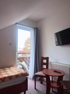 TV a/nebo společenská místnost v ubytování DW Belmara - Plaża Zachodnia - Ścieżka R10