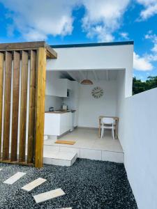 a kitchen and dining area of a house at Oasis in Petit-Bourg