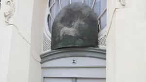 a painting of a deer on the side of a building at Apartments im Einhornhaus in Lübeck