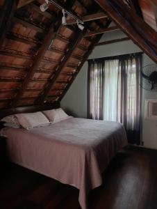 Llit o llits en una habitació de Cabana Cachoeira