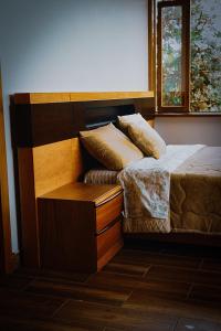 a bedroom with a bed and a window at El Toro en Bicicleta in San Miguel de los Bancos +55 photos