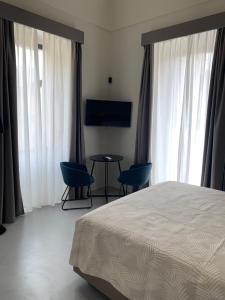 TV a/nebo společenská místnost v ubytování Donna Caterina