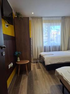 Postel nebo postele na pokoji v ubytování Apartament LaPassione Tecuci