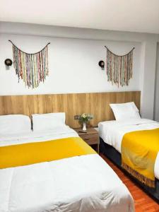 クスコにあるMarvelous Plazaの部屋に並んで置かれた2つのベッド