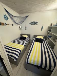 En eller flere senge i et værelse på Appartement splendide vue mer