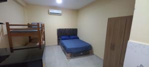 Ένα ή περισσότερα κρεβάτια σε δωμάτιο στο San Cosme Alojamiento +4 φωτογραφίες