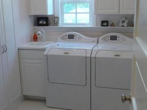 a white kitchen with white washer and dryer at Private room with shared bathroom in house - Mini Mansion in Burbank