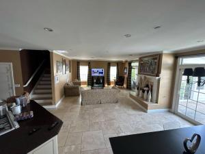 a large living room with a couch and a fireplace at Private room with shared bathroom in house - Mini Mansion in Burbank