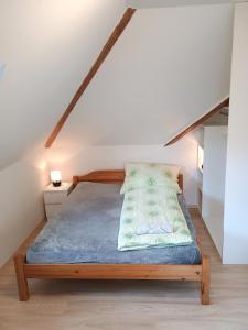 a bedroom with a bed in the attic at Ubytování nad kostelem in Prague