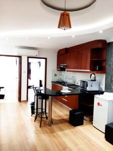 a kitchen with a black table in a room at Hotel Adulam in Santa Cruz de la Sierra