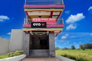 a colorful building with a sign on it at SPOT ON Pradhan Hotel in Bhīta