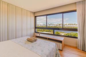 Postel nebo postele na pokoji v ubytování SA05 Excelente Casa 5 Suítes - Condomínio Reserva de Sauípe + 67 fotografií