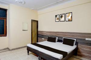 Ένα ή περισσότερα κρεβάτια σε δωμάτιο στο Hotel O Radha Residency