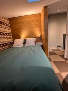 Postel nebo postele na pokoji v ubytování Appartement duplex 2Alpes centre