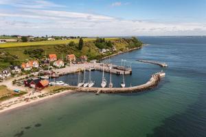 an aerial view of a dock with boats in the water at Gåsviken - Hven in Sankt Ibb +9 photos
