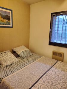 Postel nebo postele na pokoji v ubytování Hameau du soleil