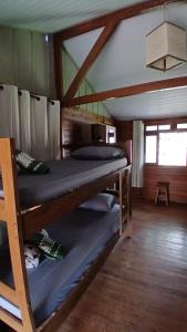 Postel nebo postele na pokoji v ubytování Cabanas LA CASITA HOSPEDAGEM FAMILIAR