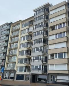 an apartment building with balconies on the side of it at Spacious Apartment With Sea View in Ostend