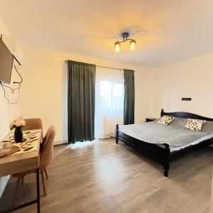 Ένα ή περισσότερα κρεβάτια σε δωμάτιο στο Coltul Verde de pe Deal