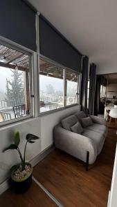 a living room with a couch and some windows at Portimão holiday home by Kerum in Portimão