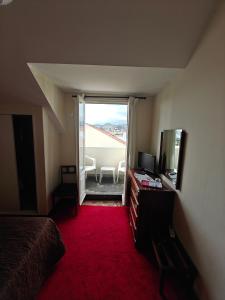 a room with a bedroom with a mirror and a dresser at Mirasol Guesthouse in Funchal +52 photos