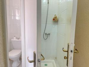 a bathroom with a shower with a toilet and a sink at Residence Diar Kisane in Marrakech